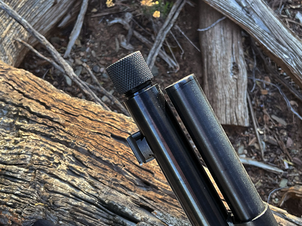 The muzzle is threaded for a suppressor.